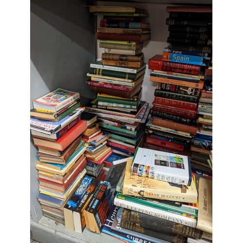 58 - A large selection of books to include Harry Potter, cook books, Tom Clancys, Astronomy books and oth... 