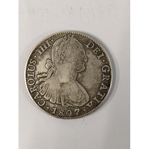 99 - !!!THIS LOT HAS BEEN WITHDRAWN!!!

A silver Carolus III coin dated 1807 Spanish or Mexican 'good to ... 