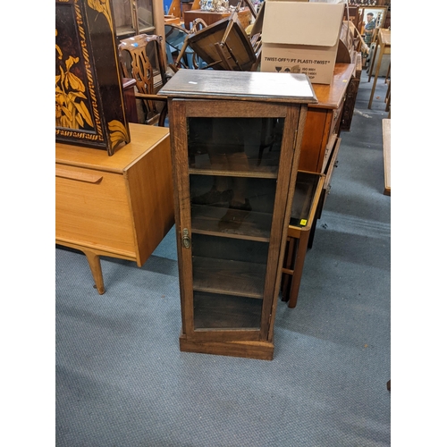 355 - An Edwardian mahogany oval occasional table together with an oak glazed cabinet
Location: A1F