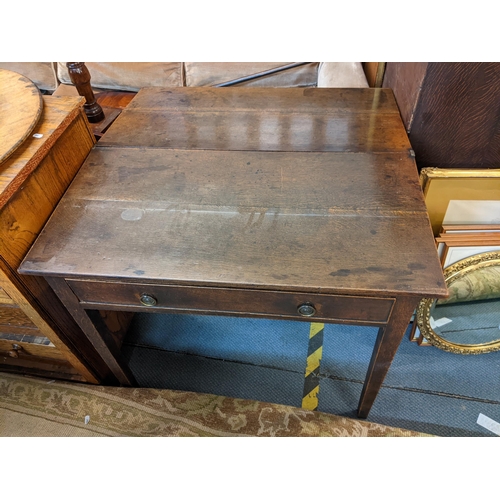 356 - An early 19th century oak fold over tea table with single drawer and on square tapering legs, 73cm h... 