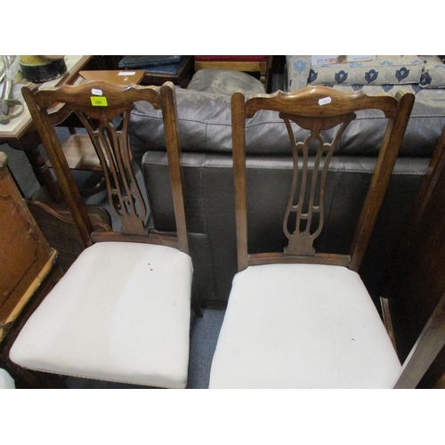 299 - A set of four Edwardian stained beech dining chairs with pierced centre splats, white fabric overstu... 