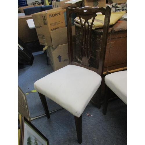 299 - A set of four Edwardian stained beech dining chairs with pierced centre splats, white fabric overstu... 