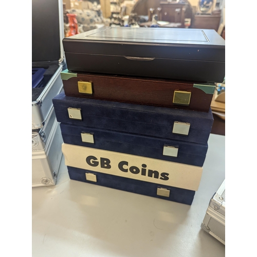 405 - A group of ten coin collecting cases to include four attache style carry cases, some containing five... 