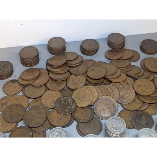 409 - A quantity of British shillings from 1920's to 1940's in various conditions, 832.7g together with a ... 