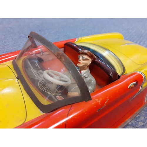 413 - A mid 20th century tin plate toy with model of a driver
Location: RWM