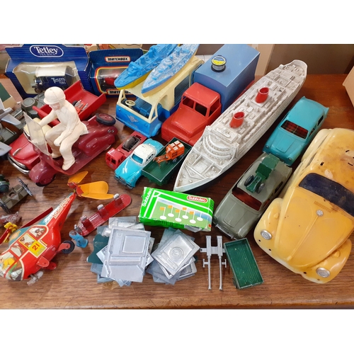 420 - Mixed mid to late children's diecast and tin plate vehicles, farm and wild animals and other items
L... 