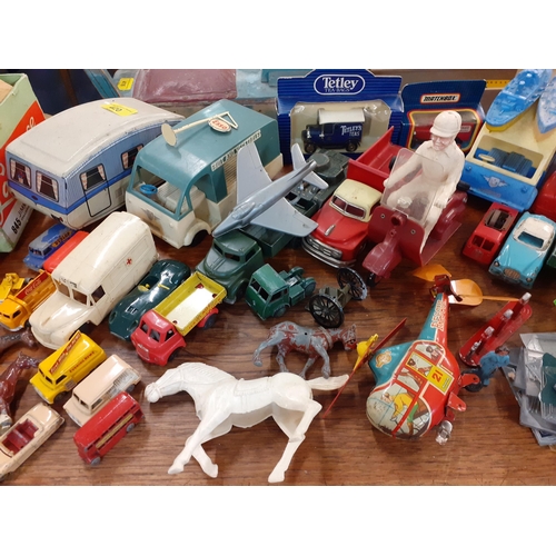 420 - Mixed mid to late children's diecast and tin plate vehicles, farm and wild animals and other items
L... 