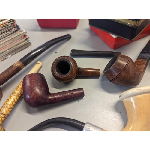 126 - A mixed lot to include mixed smoking pipes, fountain and other pens to include Parker, Postcards, mi... 