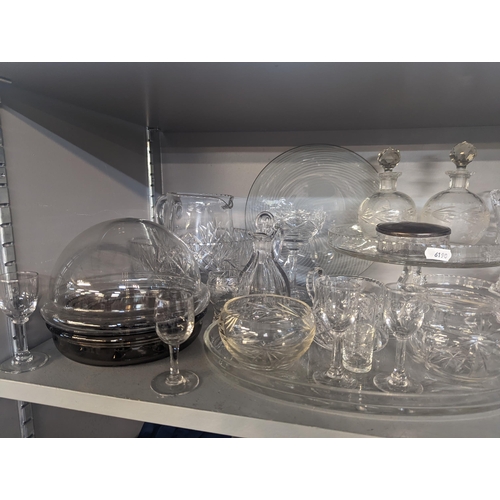 127 - A mixed lot of glassware to include household glassware, glasses, lidded jars, bowls and others, Loc... 