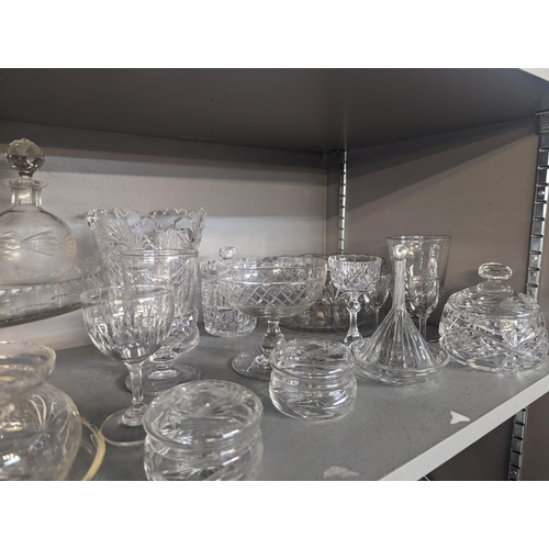 127 - A mixed lot of glassware to include household glassware, glasses, lidded jars, bowls and others, Loc... 