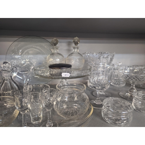 127 - A mixed lot of glassware to include household glassware, glasses, lidded jars, bowls and others, Loc... 