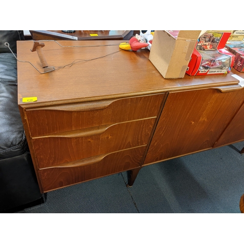 236 - A retro teak McIntosh sideboard having three drawers, two cupboard doors and a fall flap, 76cm h x 2... 