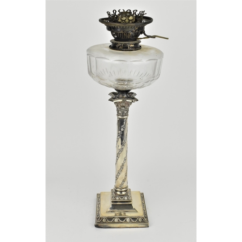 242 - An Edwardian silver oil lamp by the Goldsmiths and Silversmiths company, London 1907, in the Adams s... 