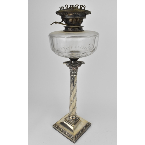 242 - An Edwardian silver oil lamp by the Goldsmiths and Silversmiths company, London 1907, in the Adams s... 