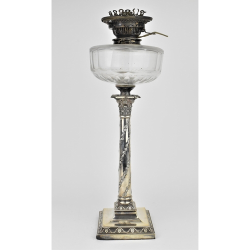 242 - An Edwardian silver oil lamp by the Goldsmiths and Silversmiths company, London 1907, in the Adams s... 