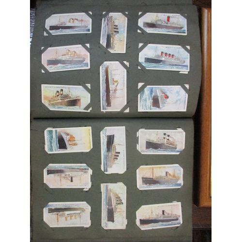 306 - An album of Will's cigarette cards, and a framed and glazed set of Player's Past and Present cigaret... 