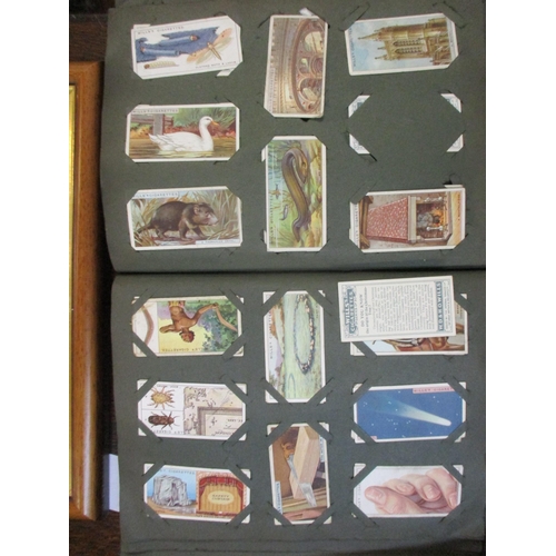 306 - An album of Will's cigarette cards, and a framed and glazed set of Player's Past and Present cigaret... 