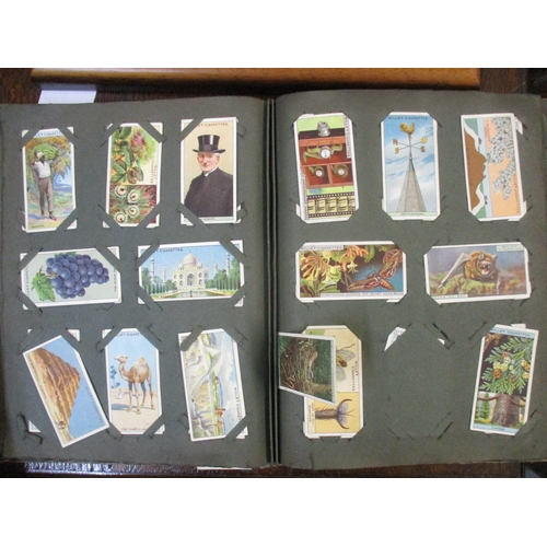 306 - An album of Will's cigarette cards, and a framed and glazed set of Player's Past and Present cigaret... 