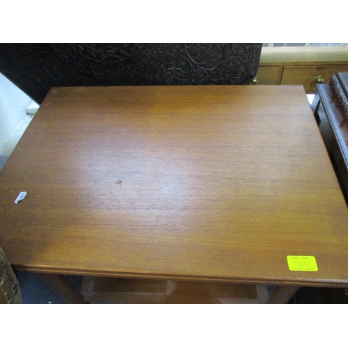 307 - A carved oak linen chest with hinged top on castors, and a mid-century teak foldover tea table with ... 