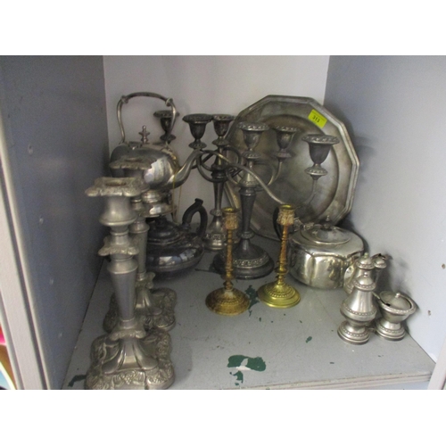 313 - A selection of silver plate and other metalwares to include two candelabras and a pair of candlestic... 