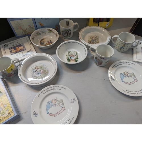 424 - A mixed lot to include Beatrix Potter ceramics to include Wedgwood and others, a Pelham Puppet, 1999... 