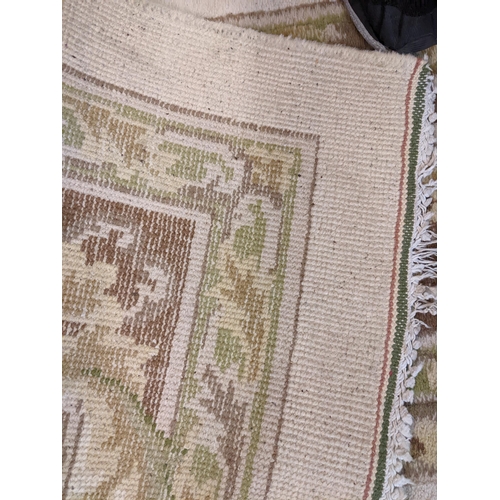 460 - A large cream ground carpet having a floral design and central motif Location: LAB