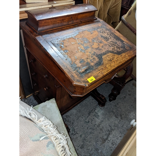 498 - A Victorian walnut Davenport having inlaid decoration, a hinged top and drawers to one side, 81cm h ... 