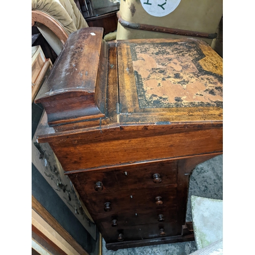 498 - A Victorian walnut Davenport having inlaid decoration, a hinged top and drawers to one side, 81cm h ... 