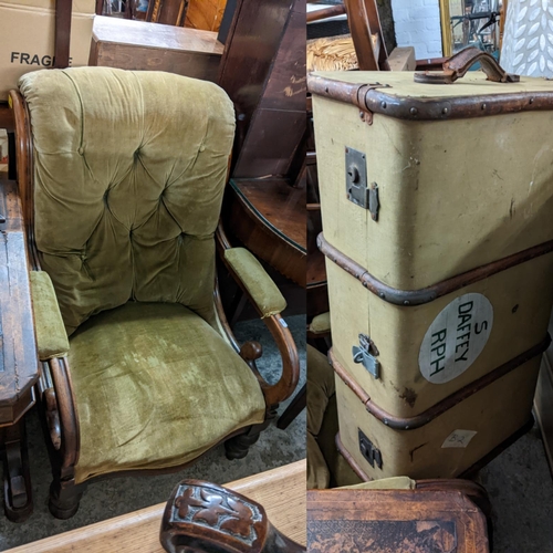 499 - A Victorian walnut button back armchair on turned legs, together with a vintage twin handled suitcas... 