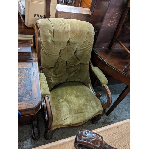 499 - A Victorian walnut button back armchair on turned legs, together with a vintage twin handled suitcas... 