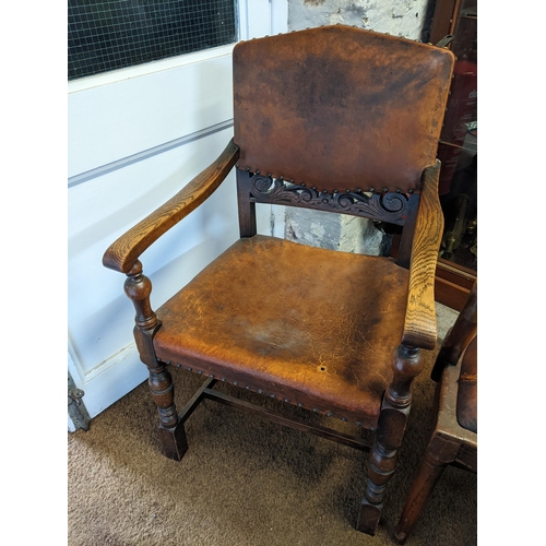 444 - Two chairs to include a Victorian serpentine fronted armchair and an oak carved leather stud back ca... 