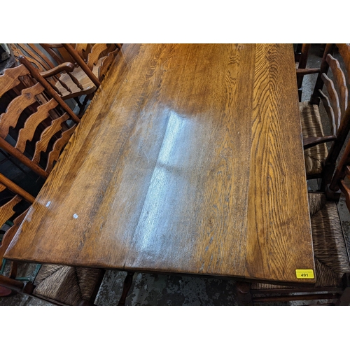 491 - A reproduction oak refectory dining table with two extra leaves, 75cm h x 195cm w, unextended, toget... 