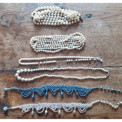 54 - A collection of seed, freshwater and faux pearl necklaces in various lengths, styles and colours. Lo... 