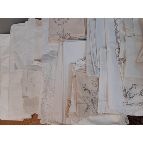 70 - A quantity of vintage linen to include Horrockses white cotton sheets, napkins and table mats all ho... 