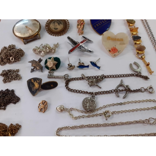 73 - A small quantity of costume jewellery to include a 1953 Coronation brooch with a picture of Queen El... 