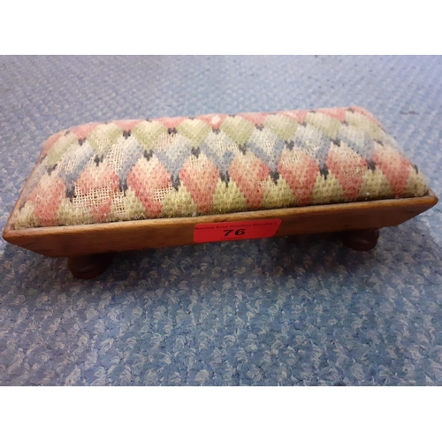 76 - An early mahogany framed pin cushion in the form of a footed tapestry topped stool, 18cm Long x 8cm ... 