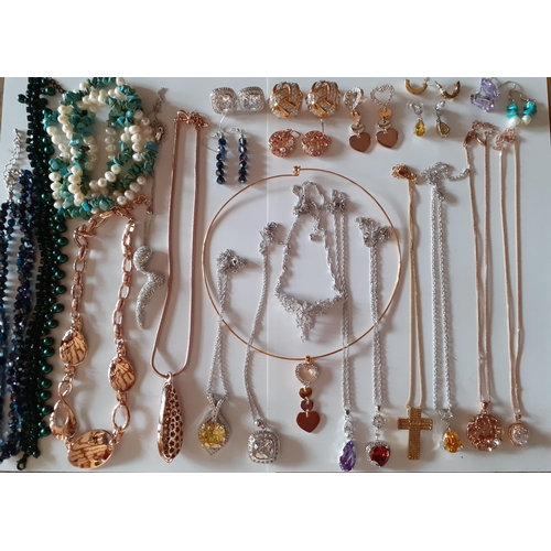 83 - A large quantity of modern costume jewellery to include Martin James necklace and earring sets in go... 