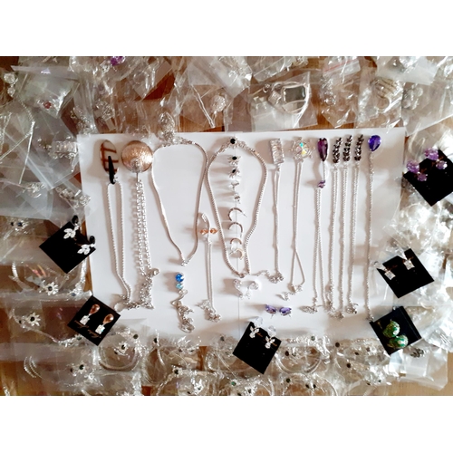 84 - A large quantity of modern costume jewellery to include necklace and earring sets in silver tones wi... 