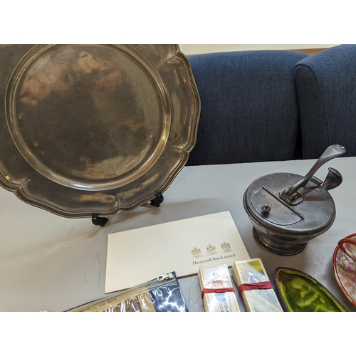 419 - A mixed lot of collectables to include a carved smoking pipe, stamps, silver plated platter and othe... 