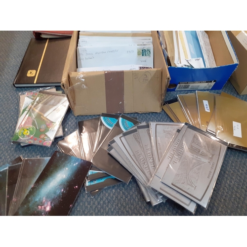 417 - Five empty stamp albums, a quantity of loose stamps in envelopes and mint stamp books (over £200+ fa... 