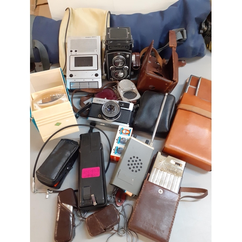 457 - Vintage cameras and equipment to include a Rollieflex and an Olympus Trip 35 camera
Location: 3.2