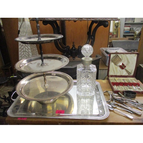 418 - A selection of silver plate to include a French twin-handled tray, a three-tier cake stan, glass whi... 