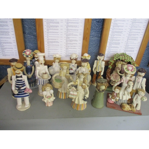 460 - A collection of Laura Dunn pottery figures A/F. Location: BWL