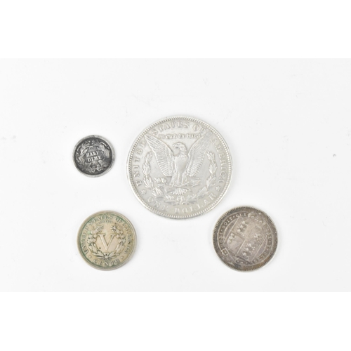 111 - United States of America - a 1887 'Morgan' dollar, 1911 five cents and a 1861 dime together with a B... 