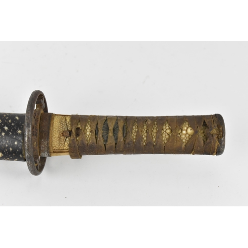 34 - A Japanese Meiji or earlier period wakizashi, with pierced iron tsuba, the tsuka fabric bound on ray... 