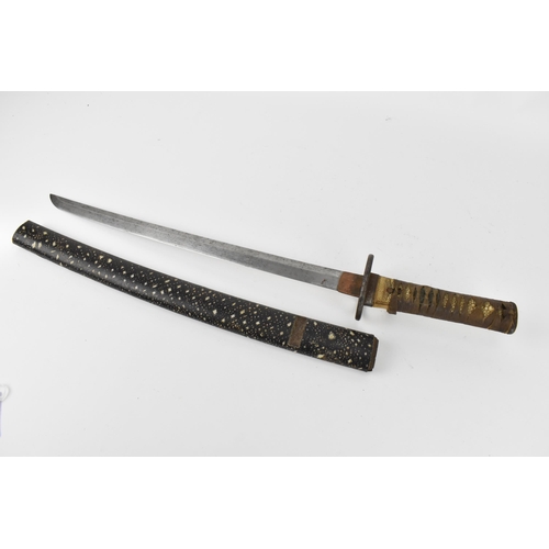 34 - A Japanese Meiji or earlier period wakizashi, with pierced iron tsuba, the tsuka fabric bound on ray... 