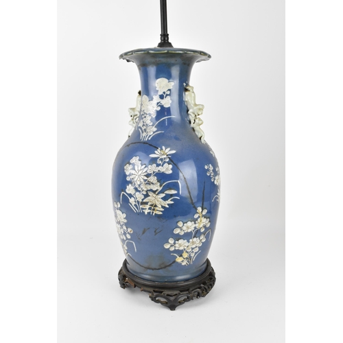 75 - A large Chinese blue and white porcelain vase converted to a lamp, of baluster form, the blue body w... 