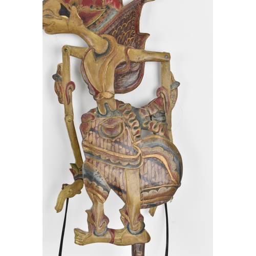 76 - Two late 19th/early 20th century Indonesian Wayang shadow puppets, to include one made of wood with ... 