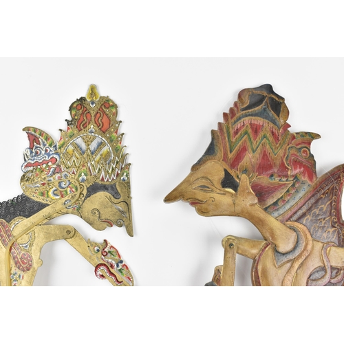 76 - Two late 19th/early 20th century Indonesian Wayang shadow puppets, to include one made of wood with ... 