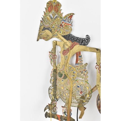 76 - Two late 19th/early 20th century Indonesian Wayang shadow puppets, to include one made of wood with ... 